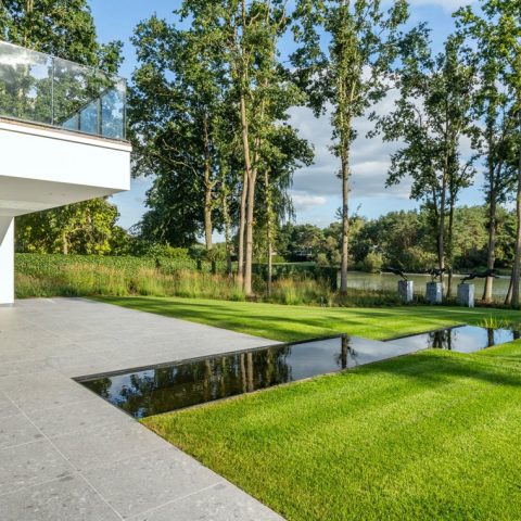 Modern villa garden with overflow as a waterfall