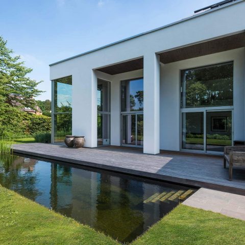 Sleek modern villa with swimming pond