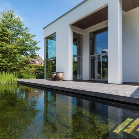 Sleek modern villa with swimming pond