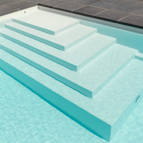 Modern outdoor pool in green surroundings