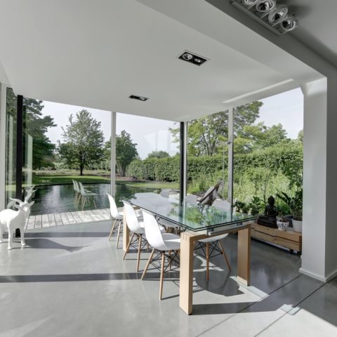 Swimming pond at modern villa in Zoersel