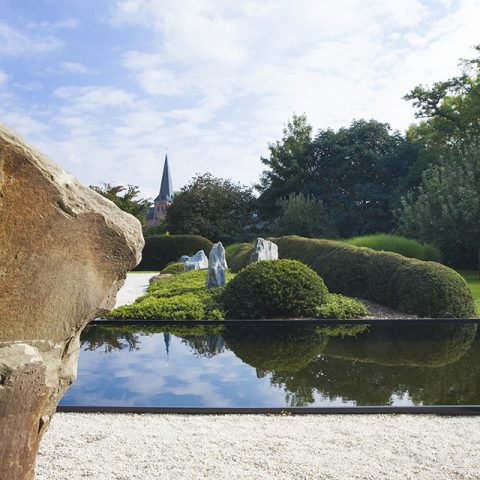 Beautiful natural swimming pond in Japanese inspired garden