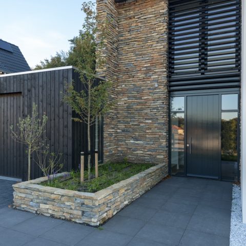 Cubist house with natural stone facade in Ede
