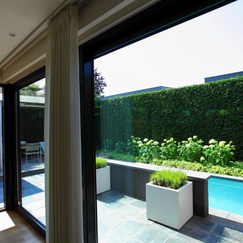Sleek small garden with pool and porch
