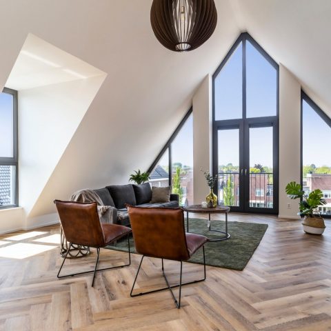 Black wooden kitchen in penthouse Middelharnis