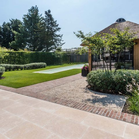 Rural garden with wooden outbuilding and pool