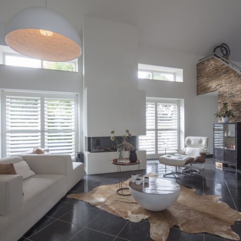 Modernized farmhouse with modern shutters