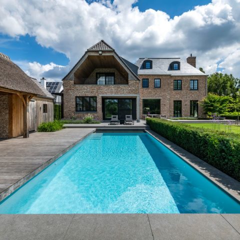 Pool house with thatched roof