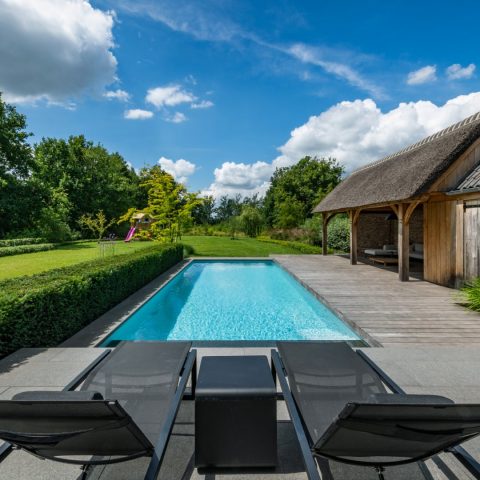 Pool house with thatched roof