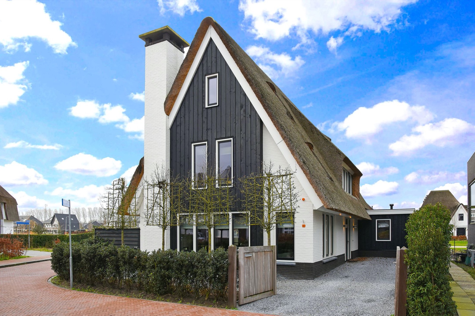 High end white thatched villa with beautiful black wood accents ,Cottage,Housing,Building,House,Bush,Plant,Grass,Villa,Outdoors,Urban, Luxury, Design, Exclusive, Modern, Custom Made, Special, Beautiful