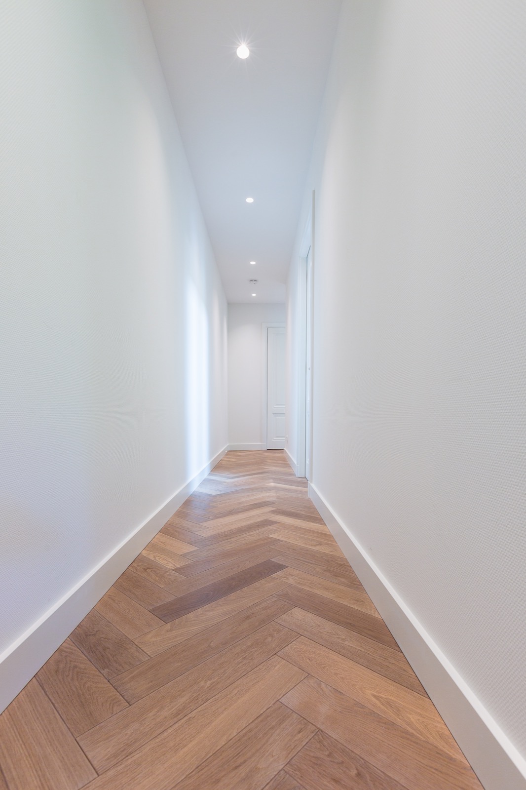 oak modern herringbone floor,Corridor,Floor,Flooring,Indoors,Wood,Interior Design,Lighting,Hall,Ceiling Light,Housing, Luxury, Design, Exclusive, Modern, Custom Made, Special, Beautiful