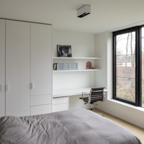 Custom dressing room, children’s rooms and laundry storage for a contemporary home in Schilde, Belgium