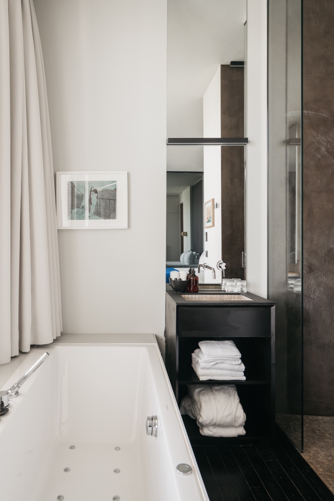 Modern black sink with beige tile interior, chrome faucet, high-gloss white bathtub, glass shower door ,Corner,Indoors,Tub,Room,Interior Design,Laundry,Person,Bathtub,Bathroom,Home Decor, Luxury, Design, Exclusive, Modern, Custom Made, Special, Beautiful