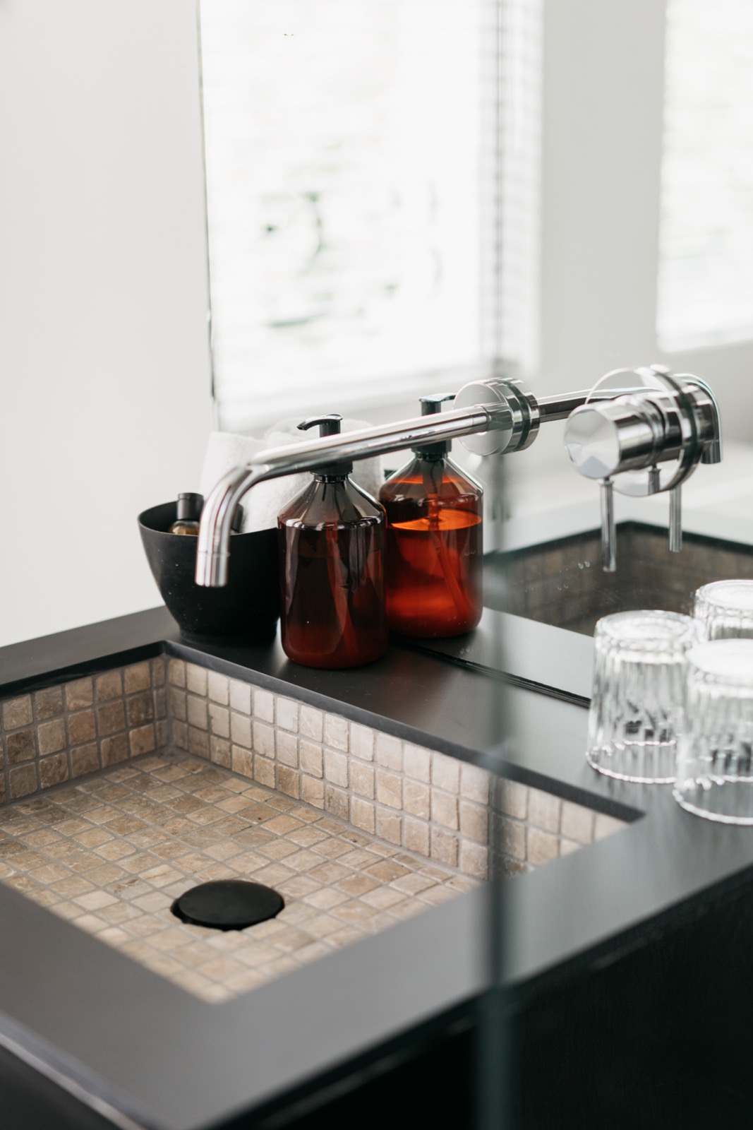 Modern black sink with beige tile interior, chrome faucet ,Indoors,Room,Sink Faucet,Jar,Glass,Mixer,Bathroom,Dishwasher,Sink,Lab, Luxury, Design, Exclusive, Modern, Custom Made, Special, Beautiful