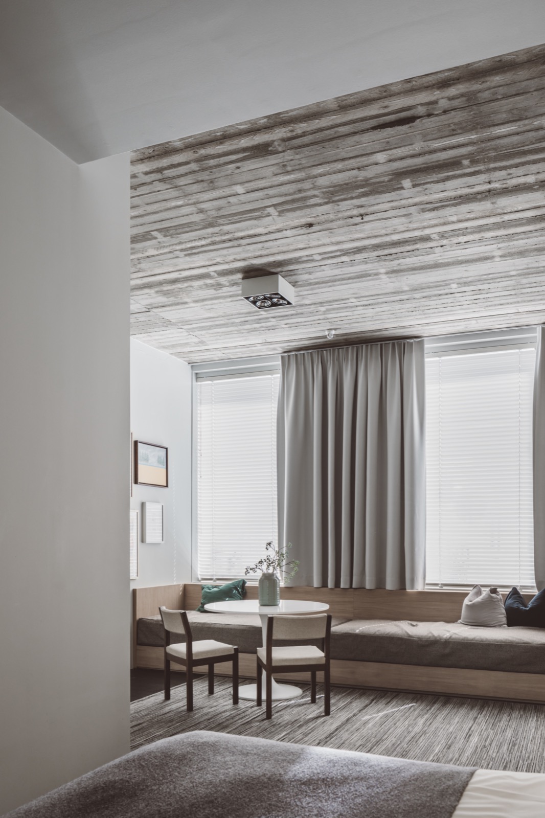 Modern wooden sofa with grey cushions, high gloss white round dining table, wooden dining chairs with beige upholstery ,Home Decor,Chair,Furniture,Room,Indoors,Window,Table,Curtain,Picture Window,Living Room, Luxury, Design, Exclusive, Modern, Custom Made, Special, Beautiful