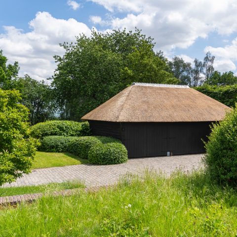 Garage with thatched roof