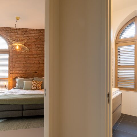 Converted church with shutters as window coverings