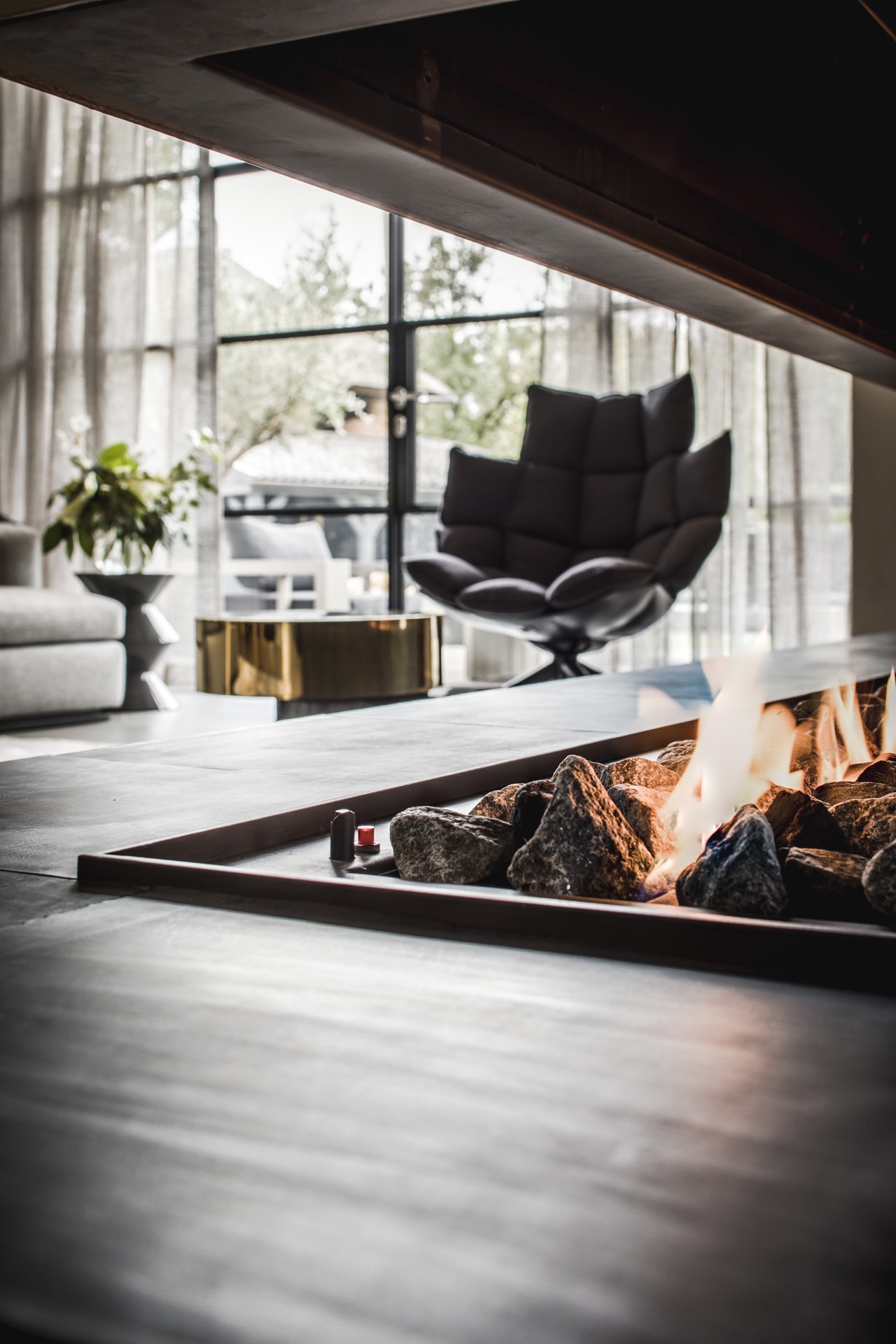 Fireplace with armchair,Indoors,Interior Design,Housing,Building,Fireplace,Room,Rug,Living Room,Chair,Furniture, Luxury, Design, Exclusive, Modern, Custom Made, Special, Beautiful