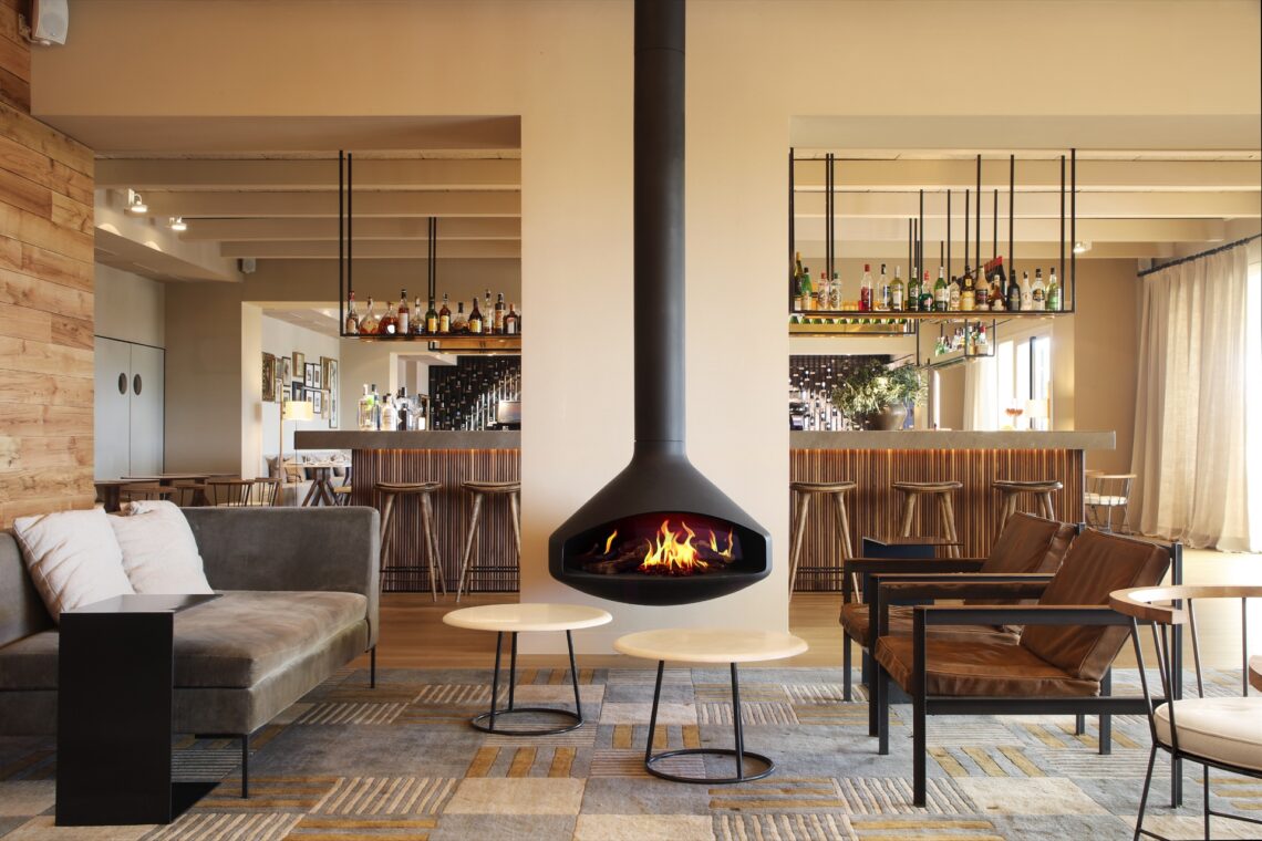 a living room filled with furniture and a fireplace