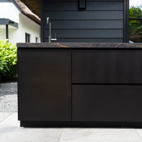 Complete outdoor kitchen with bar in Blaricum