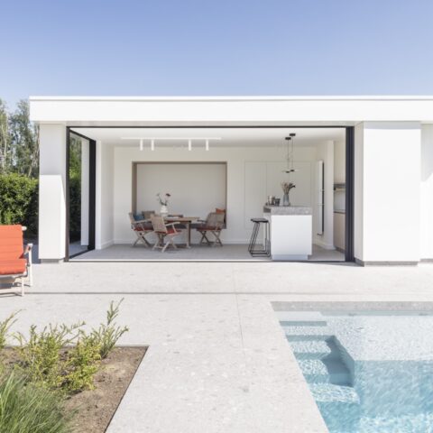 Modern pool house with playful accents