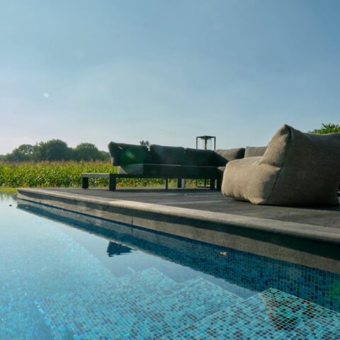 Mosaic infinity pool at modernized residential farmhouse