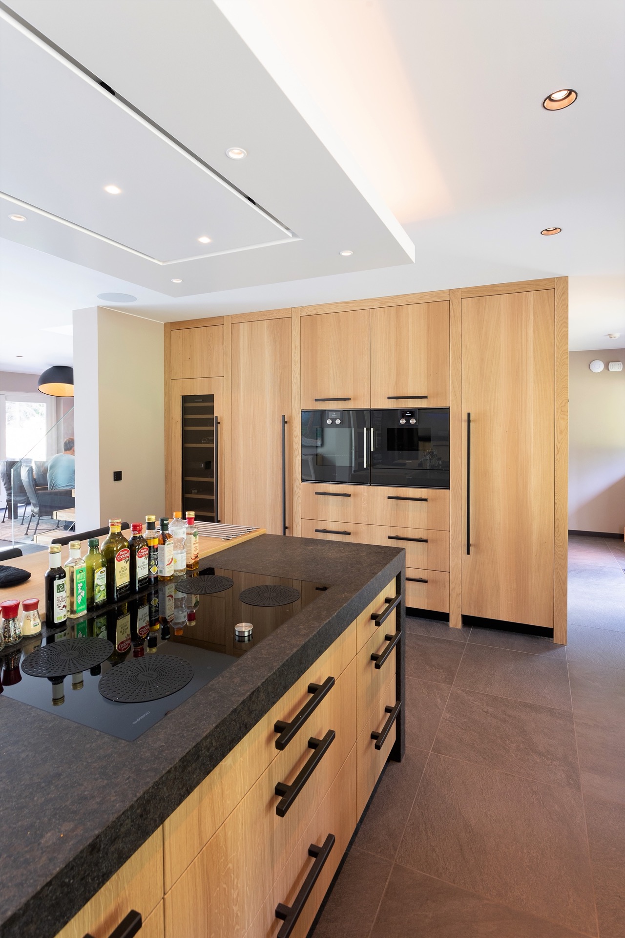 The Living Kitchen, Luxury Bungalow, Luxury Kitchen, Modern Bungalow,Interior Design,Indoors,Kitchen,Person,Microwave,Device,Cabinet,Furniture,Kitchen Island,Wood, Luxury, Design, Exclusive, Modern, Custom Made, Special, Beautiful