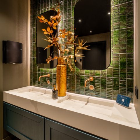 Ceramic mosaic and tile details in a renovated bistro interior