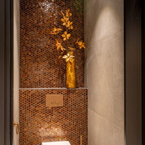 Ceramic mosaic and tile details in a renovated bistro interior