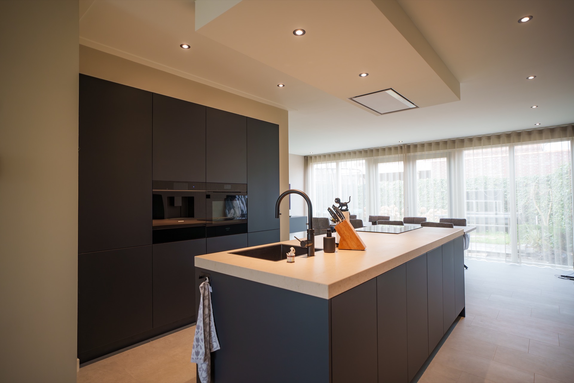 living kitchen with a kitchen island: modern kitchen with island and dark cabinetry wall, lots of daylight from large windows, Luxury, Design, Exclusive, Modern, Custom Made, Special, Beautiful