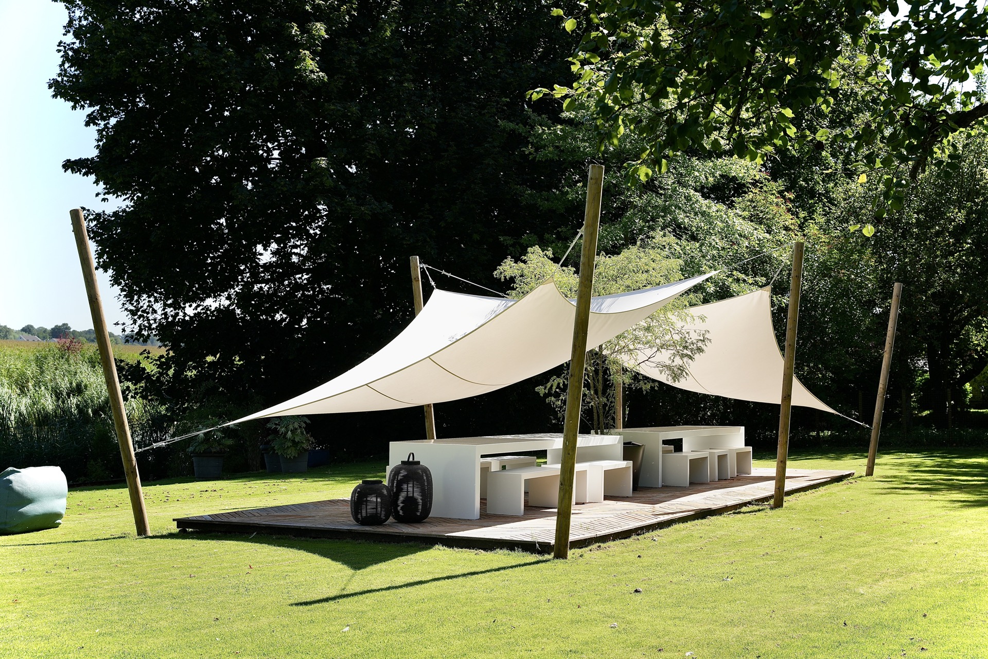 modern show garden with outdoor kitchen and lounge: luxury modern garden with terrace and white shade sail between wooden, Luxury, Design, Exclusive, Modern, Custom Made, Special, Beautiful
