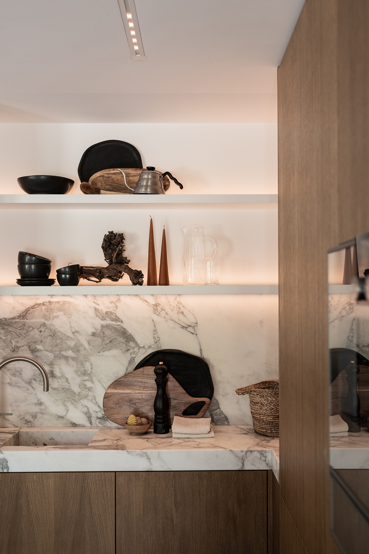 luxury full home interior: marble kitchen wall with niche lighting and wooden cabinetry in warm veneer, Luxury, Design, Exclusive, Modern, Custom Made, Special, Beautiful