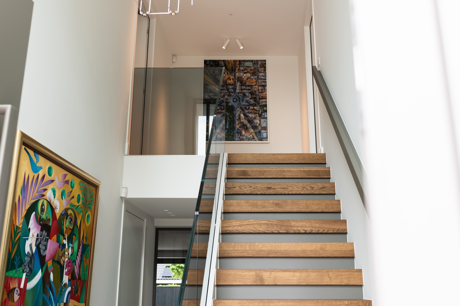luxury full home interior: open staircase with wooden steps and glass balustrade, bright light and white walls, Luxury, Design, Exclusive, Modern, Custom Made, Special, Beautiful