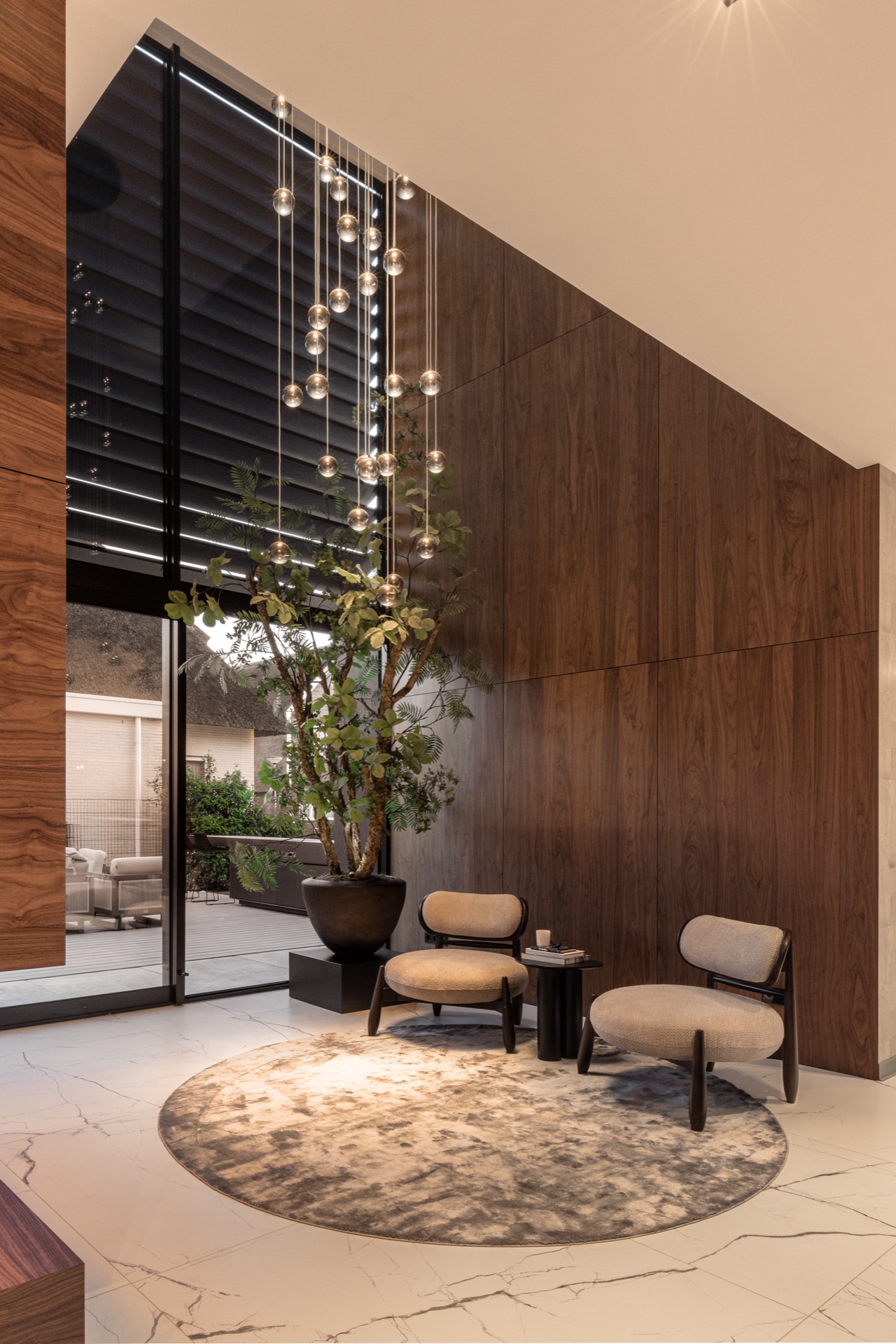 luxury pendant lighting interior: entry area with wooden wall panels and vertical row of spherical pendant lights, Luxury, Design, Exclusive, Modern, Custom Made, Special, Beautiful
