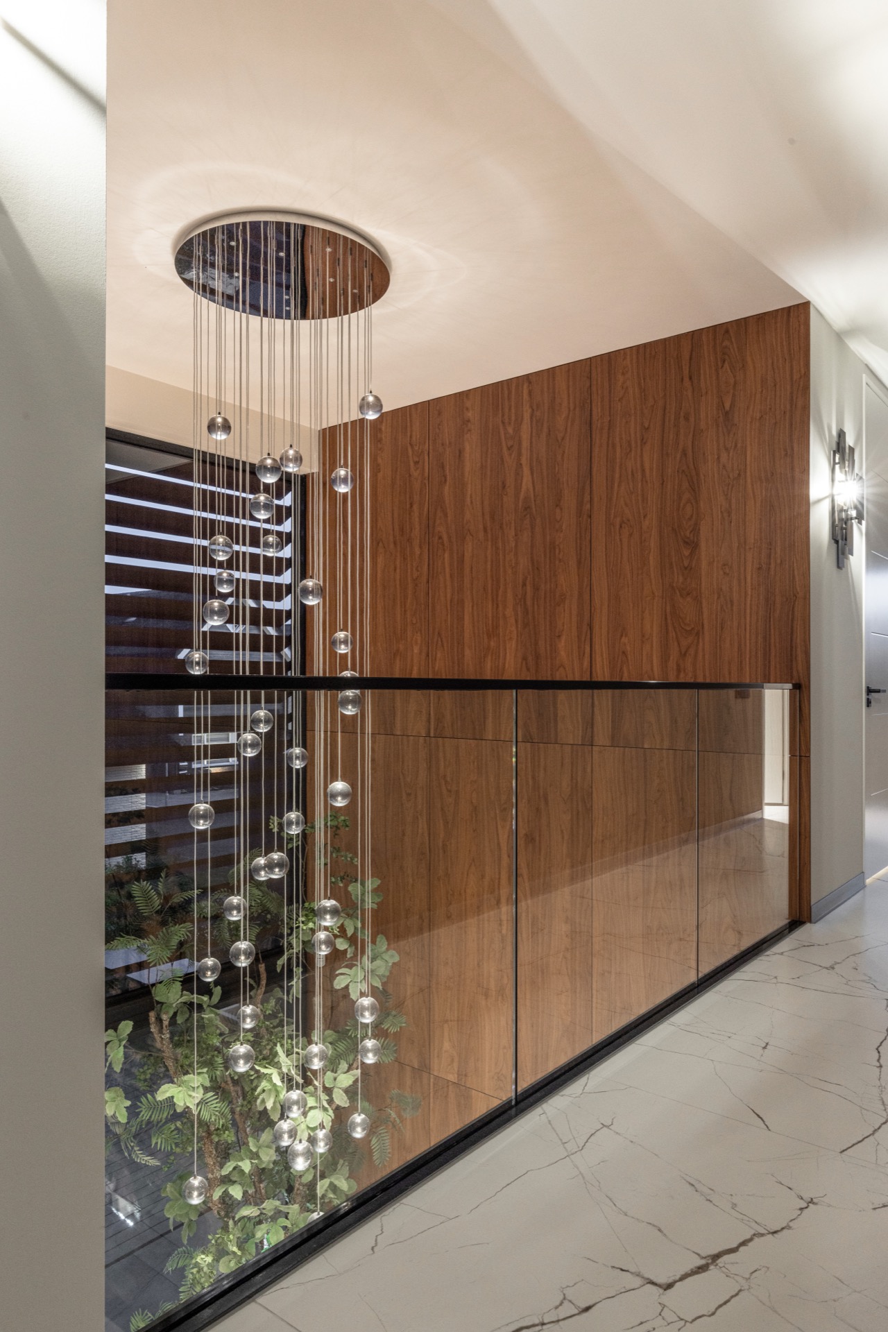 luxury pendant lighting interior: landing with glass balustrade, spherical pendant lights and wooden wall panels near the, Luxury, Design, Exclusive, Modern, Custom Made, Special, Beautiful
