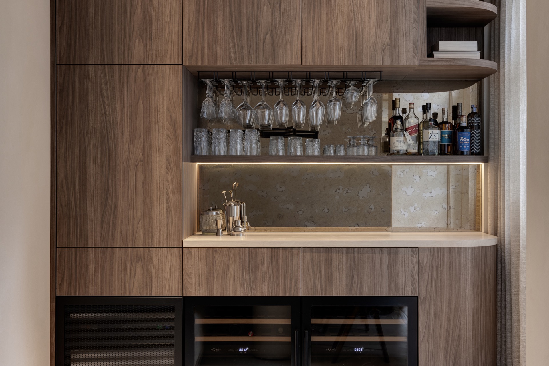 interior lighting plan: detail of a wooden bar wall with under-cabinet LED lighting and integrated open compartments, Luxury, Design, Exclusive, Modern, Custom Made, Special, Beautiful