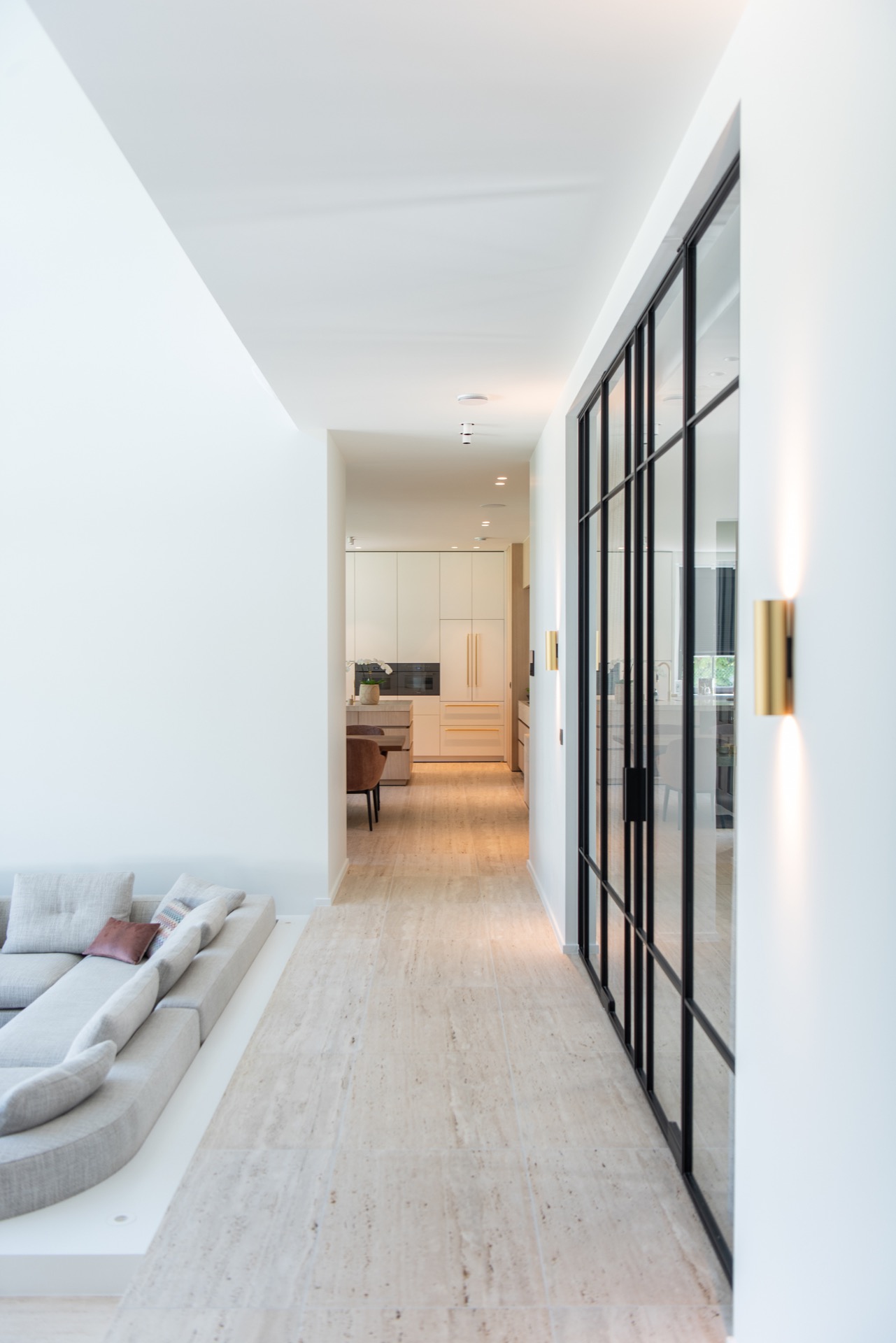 modern villa interior: hallway with black-framed glass partition and view toward the modern kitchen, Luxury, Design, Exclusive, Modern, Custom Made, Special, Beautiful