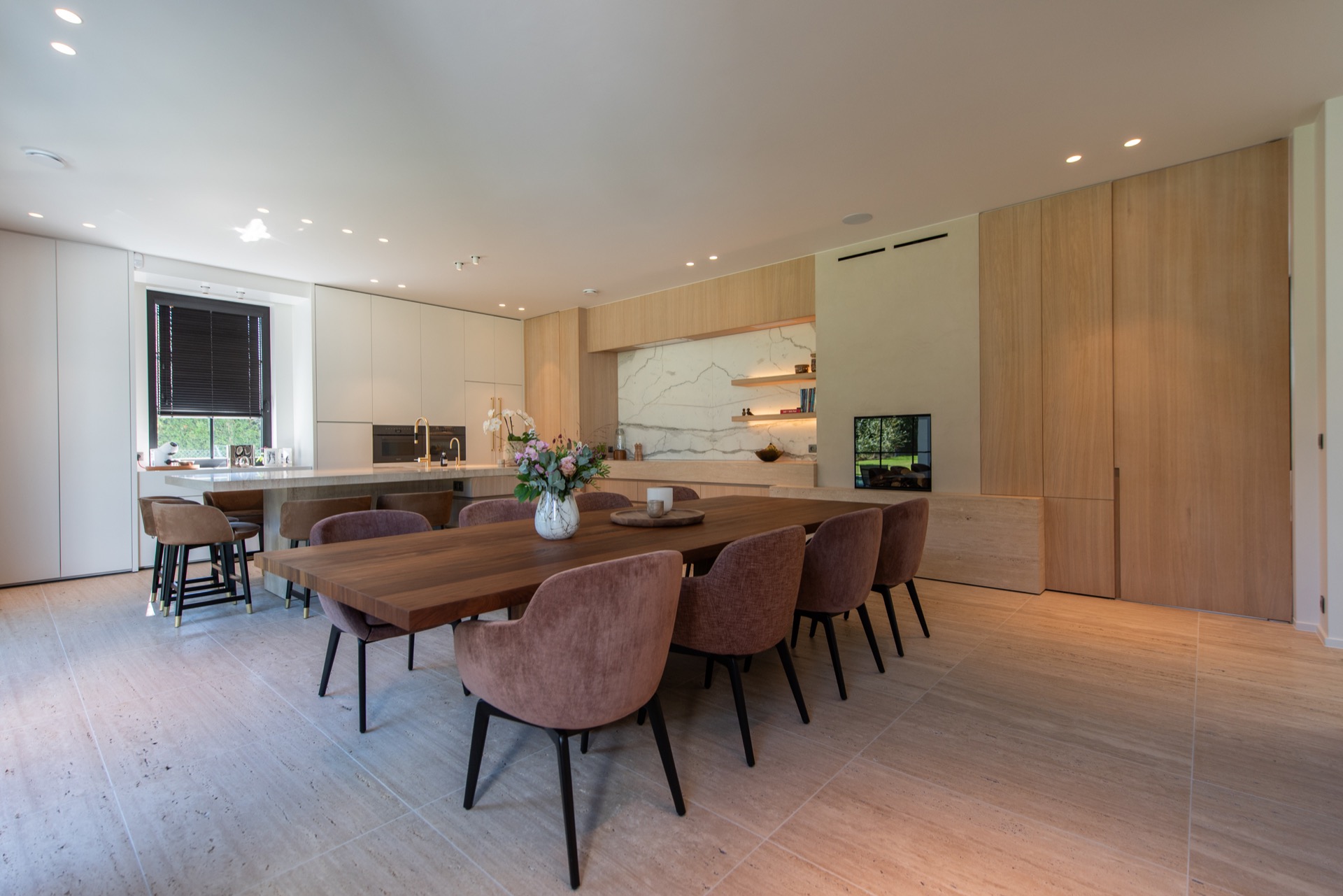 modern villa interior: kitchen with long island, wood wall panels and stone-look backsplash, Luxury, Design, Exclusive, Modern, Custom Made, Special, Beautiful