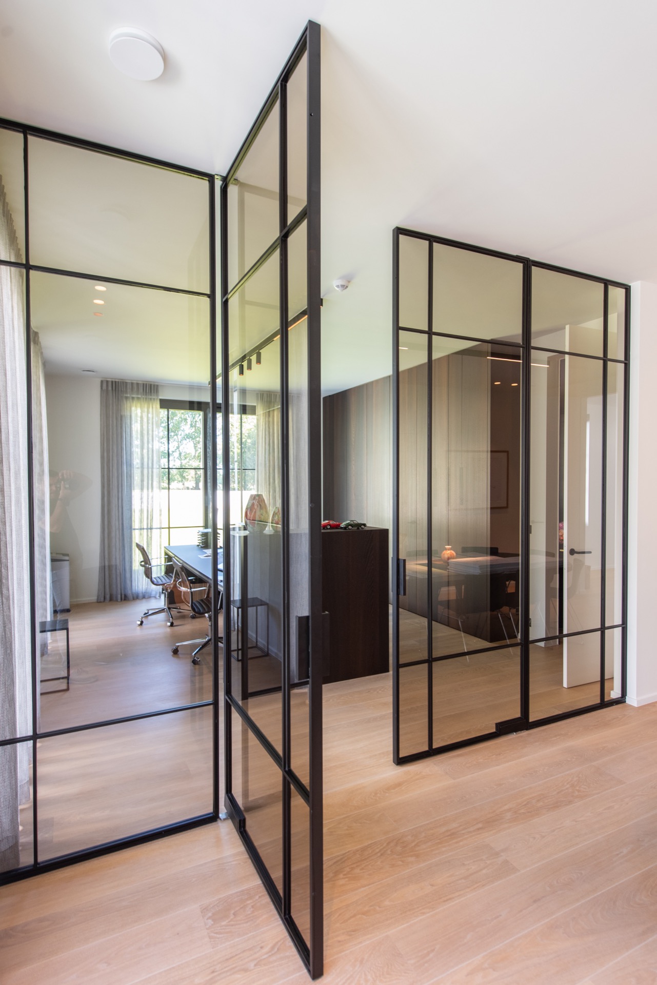 modern villa interior: modern glass interior partition with black frames and view into adjacent rooms, Luxury, Design, Exclusive, Modern, Custom Made, Special, Beautiful