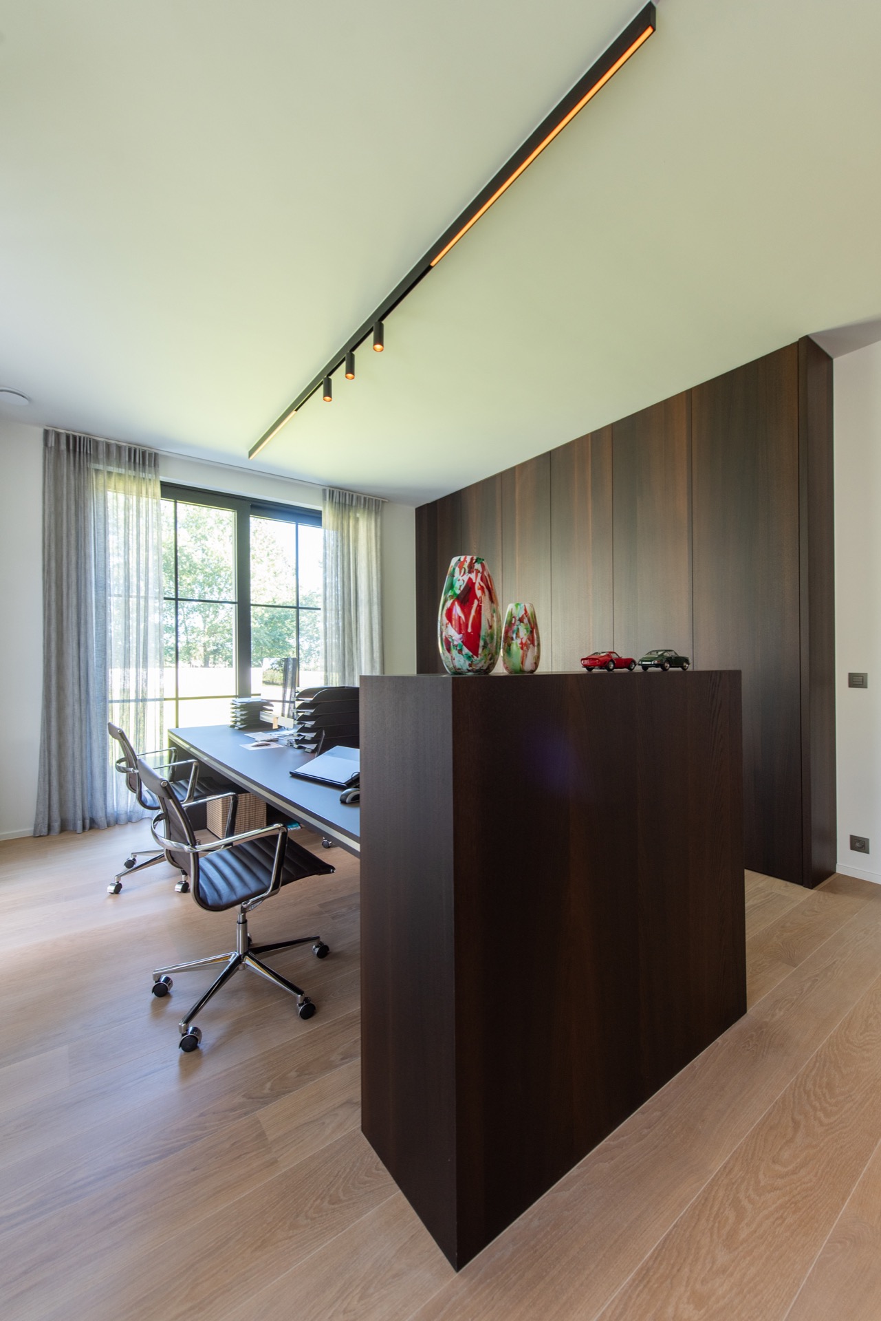 modern villa interior: office with long built-in wall cabinets, large windows and warm ceiling lighting, Luxury, Design, Exclusive, Modern, Custom Made, Special, Beautiful