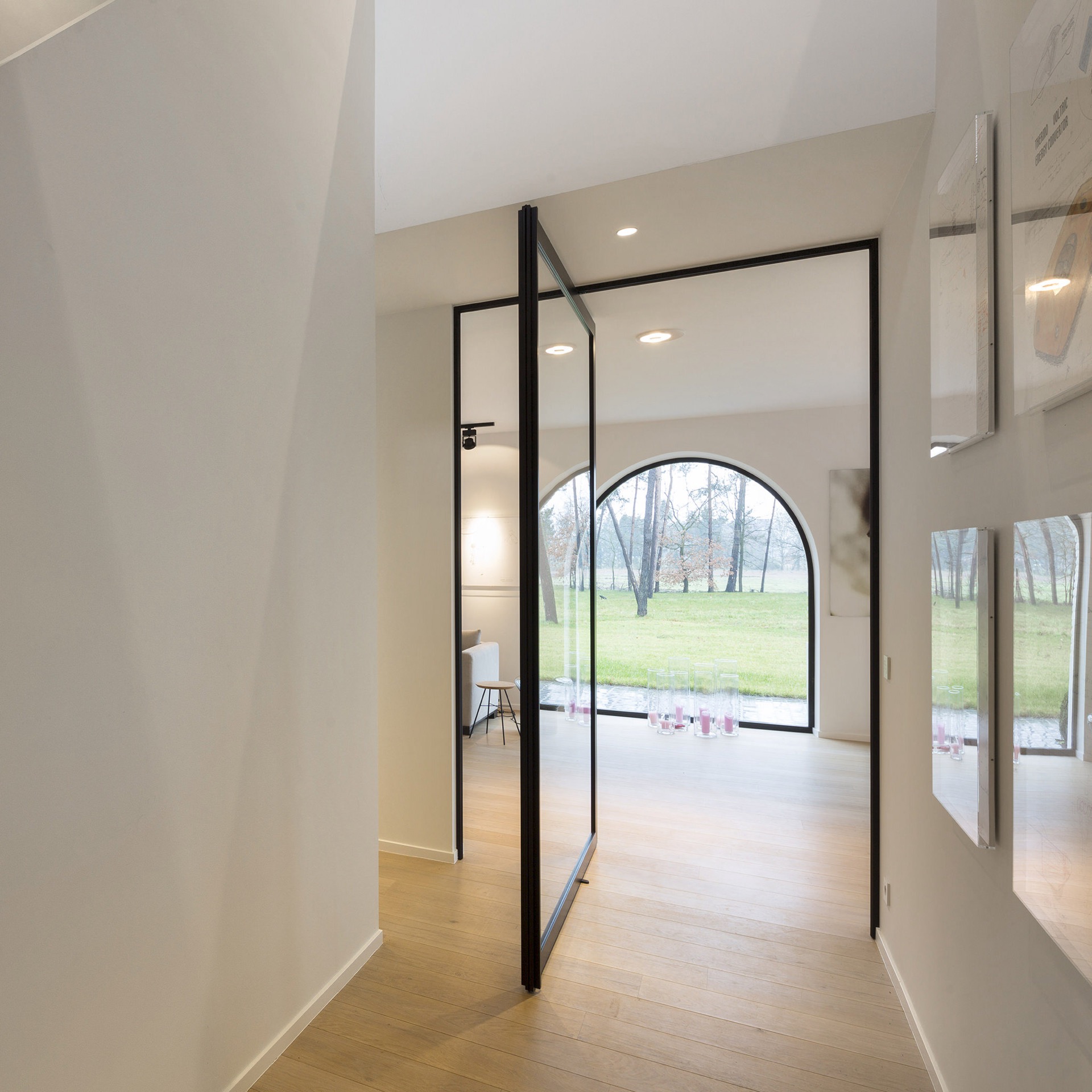 Steel look pivot door with black frame and glass panels, view to the garden, Luxury, Design, Exclusive, Modern, Custom Made, Special, Beautiful