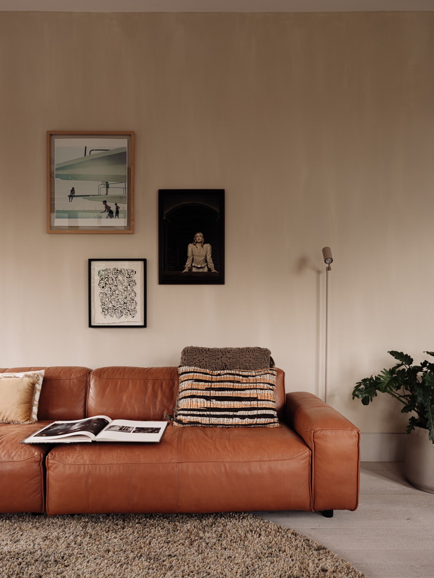 villa interior renovation: seating area with leather sofa, framed artwork on wall and standing lamp, Luxury, Design, Exclusive, Modern, Custom Made, Special, Beautiful