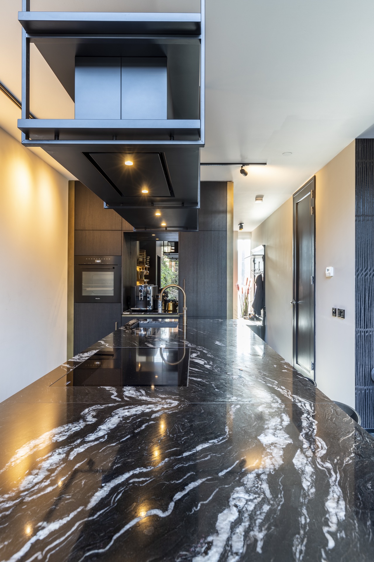 luxe metal wall finish: luxury kitchen with a large metal-look countertop and view to the garden through windows, Luxury, Design, Exclusive, Modern, Custom Made, Special, Beautiful