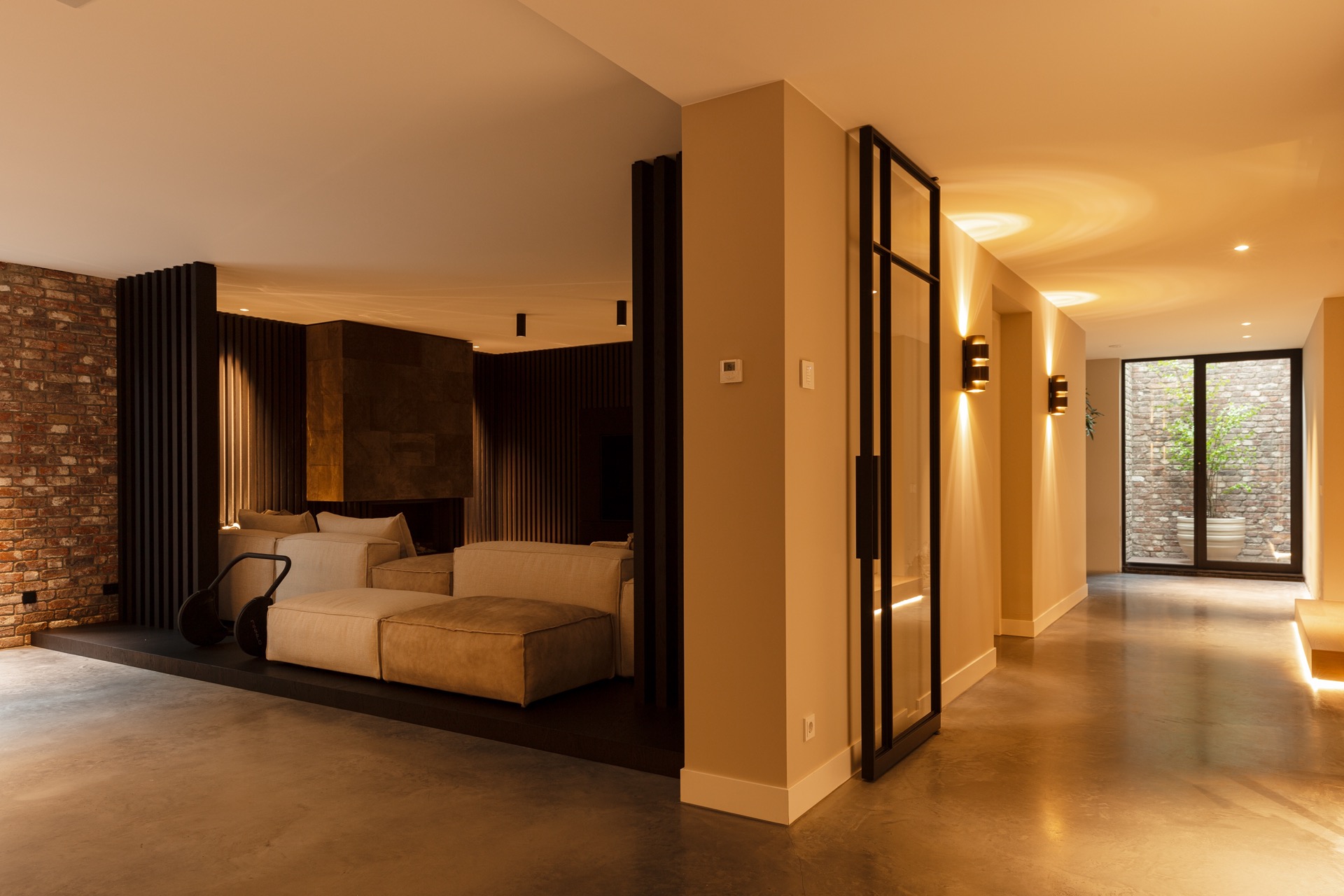 floated concrete floor in new-build villa: view from hallway to lounge with glass doors and floated concrete floor, Luxury, Design, Exclusive, Modern, Custom Made, Special, Beautiful