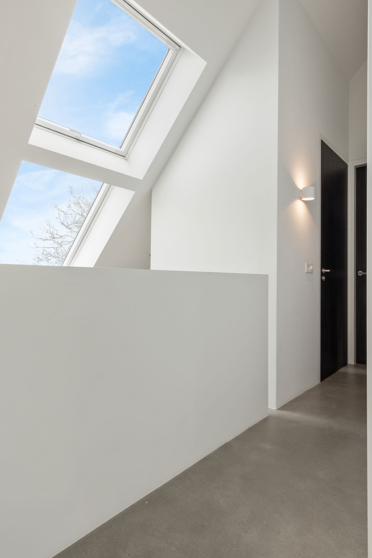 indoor-outdoor kitchen: minimal hallway with slanted skylight window, white walls and dark door opening, Luxe, Design, Exclusief, Modern, Maatwerk, Bijzondere, Mooie