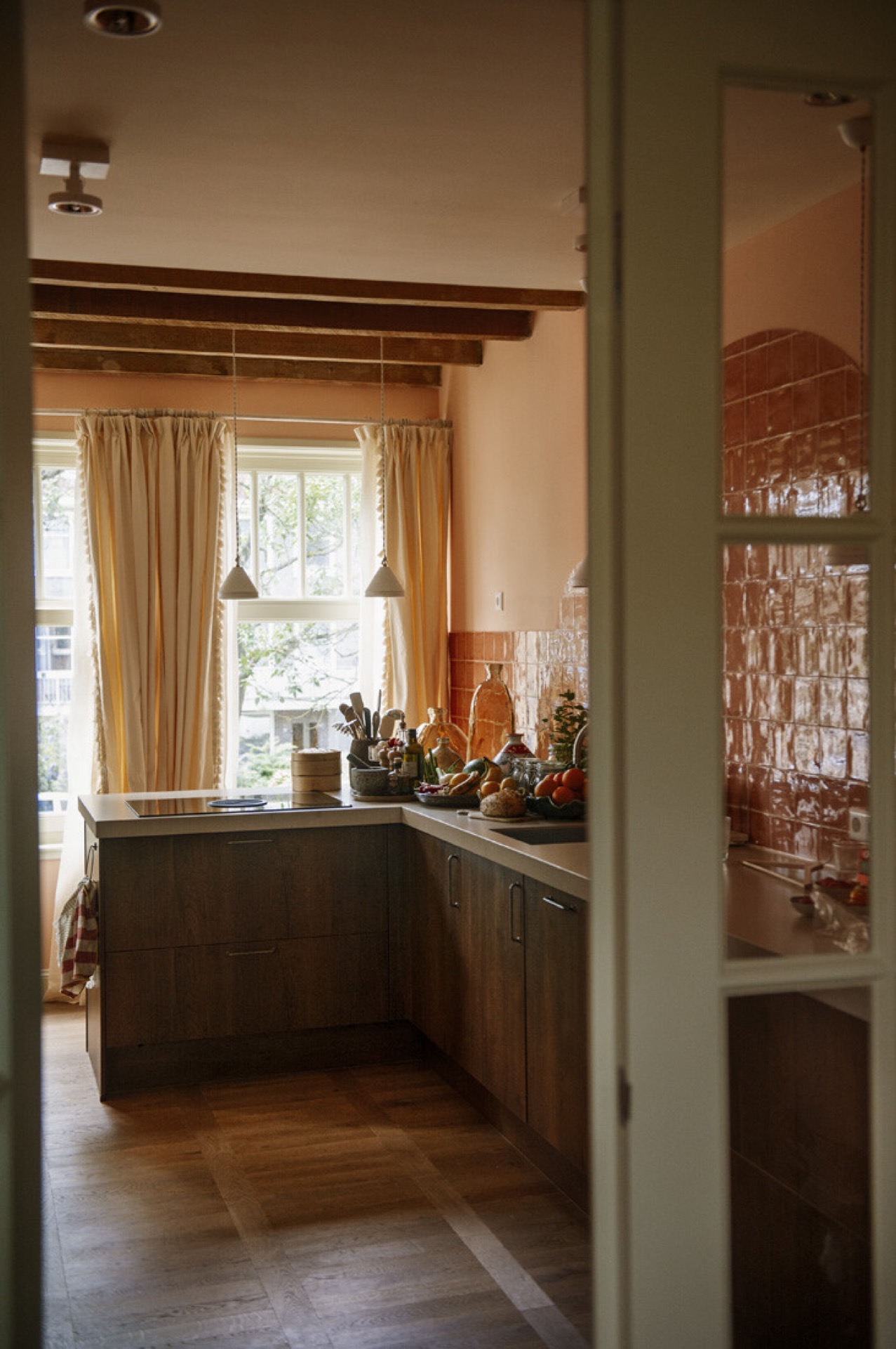 home renovation contractors: kitchen with red ceramic tiles, arched niche, wooden beams and a window with curtains, Luxe, Design, Exclusief, Modern, Maatwerk, Bijzondere, Mooie