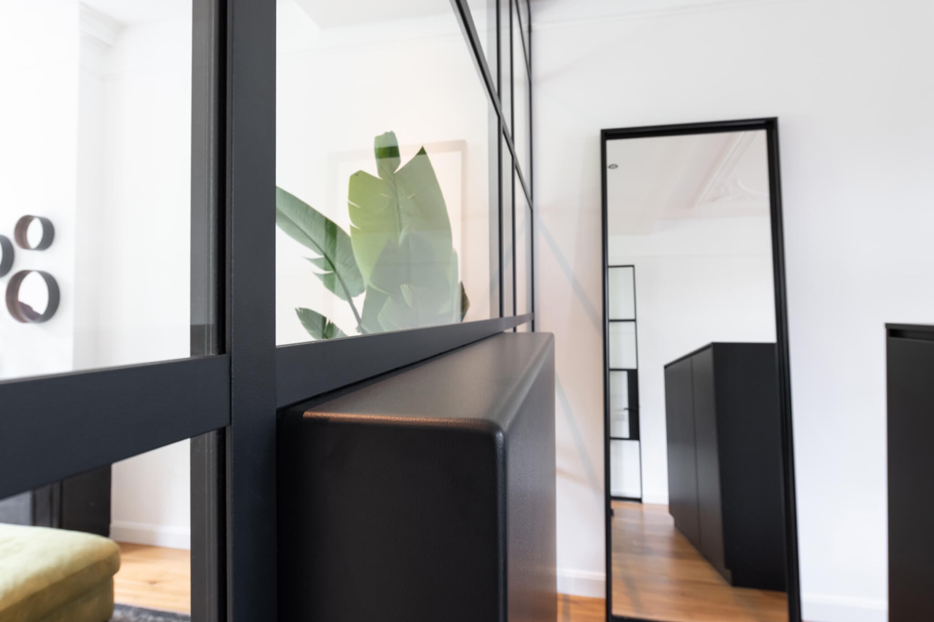 glass TV wall with hinged door: close-up of black aluminum profiles and glass panels of the cinewall, Luxury, Design, Exclusive, Modern, Custom Made, Special, Beautiful