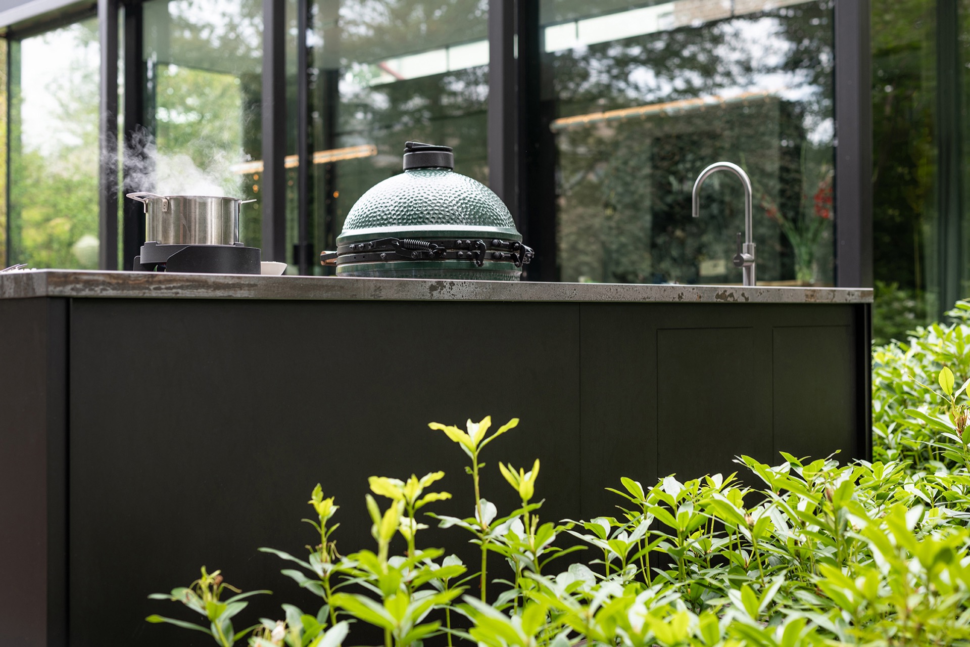 modern outdoor kitchen with natural stone worktop: close-up of countertop and front of a modern outdoor kitchen by a glass, Luxury, Design, Exclusive, Modern, Custom Made, Special, Beautiful