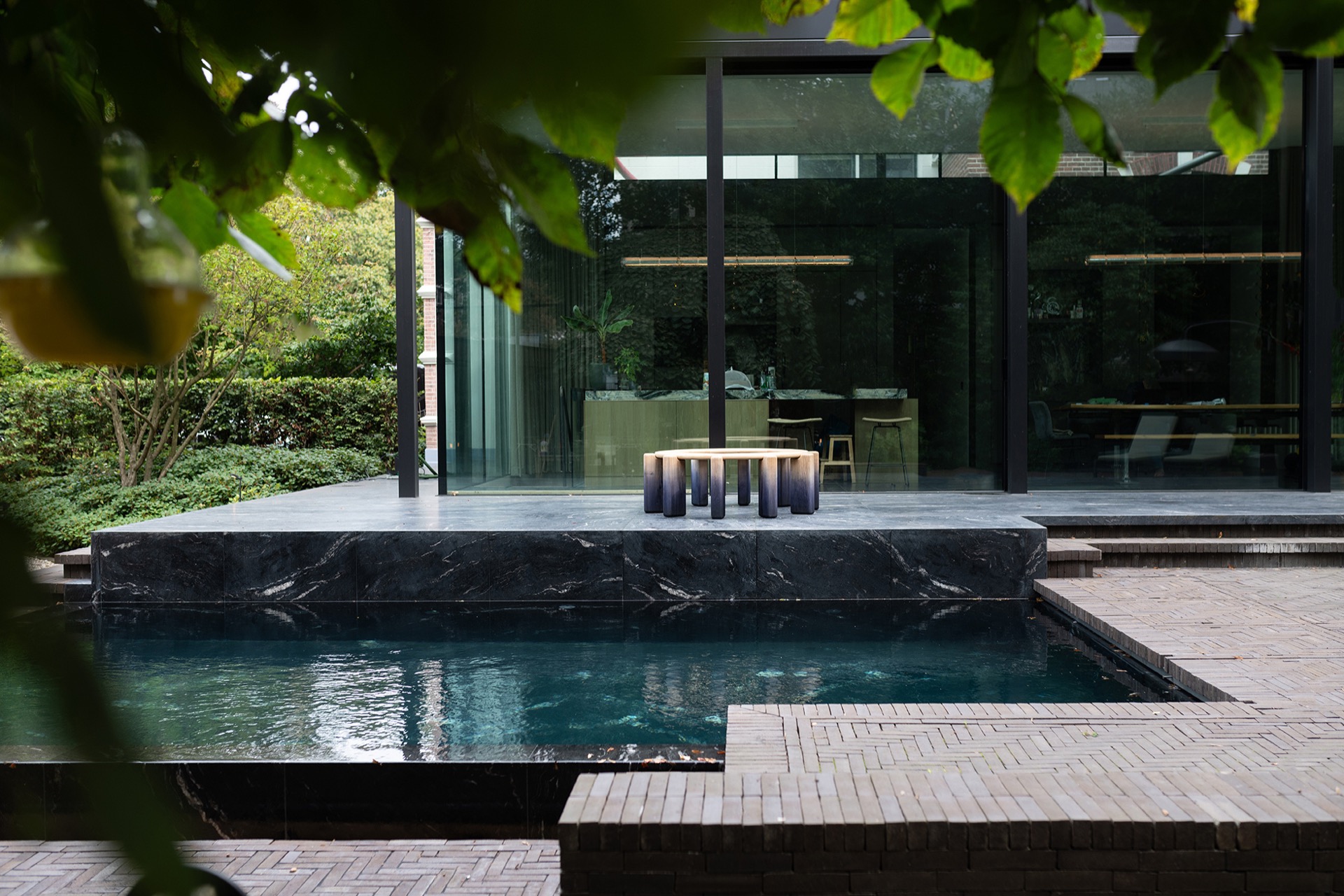 modern outdoor kitchen with natural stone worktop: clean terrace with waterline and glass wall, outdoor space with, Luxury, Design, Exclusive, Modern, Custom Made, Special, Beautiful