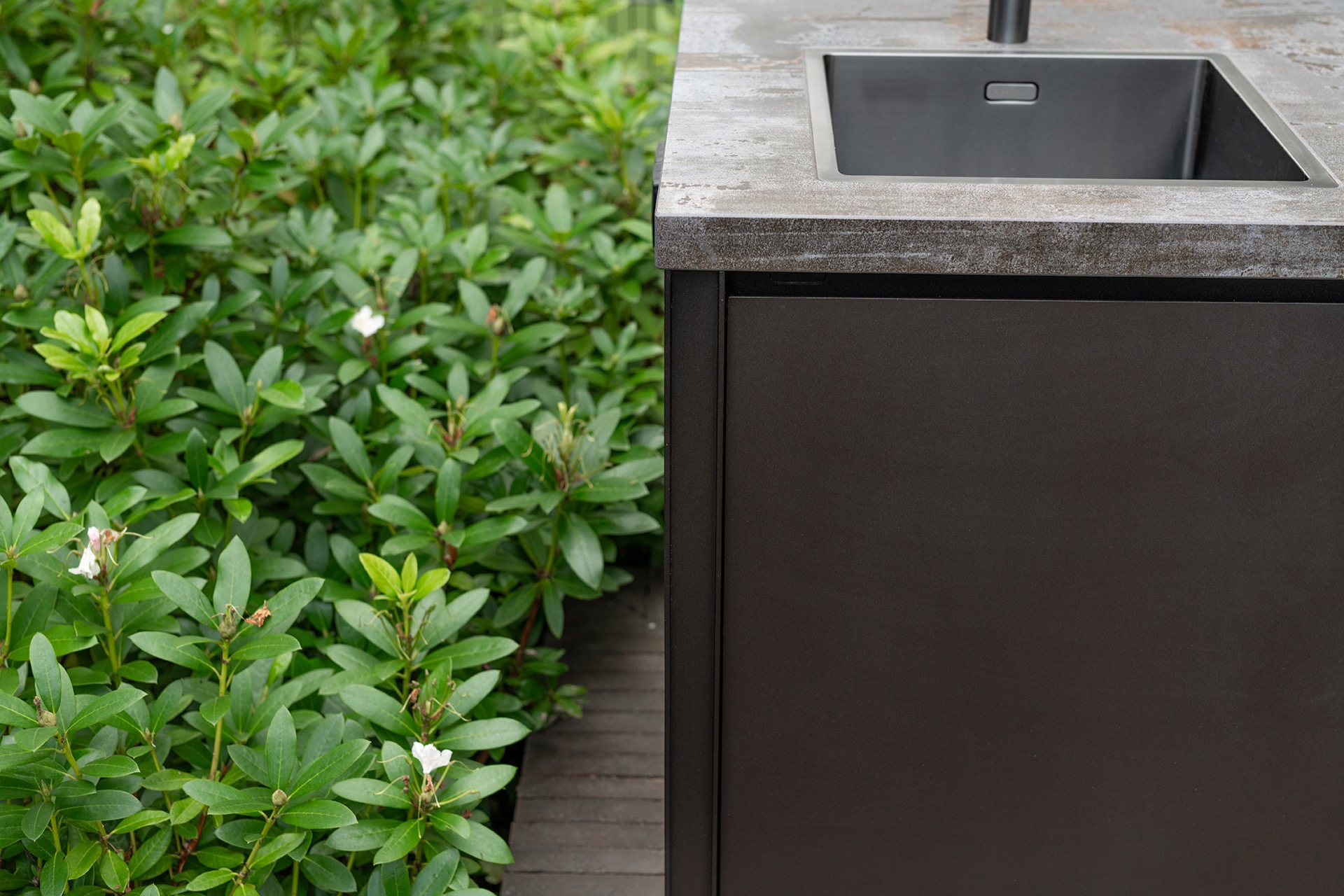 modern outdoor kitchen with natural stone worktop: detail of the sink opening and natural-stone countertop of an outdoor, Luxury, Design, Exclusive, Modern, Custom Made, Special, Beautiful